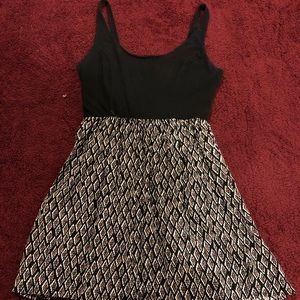 Black top patterned bottom dress